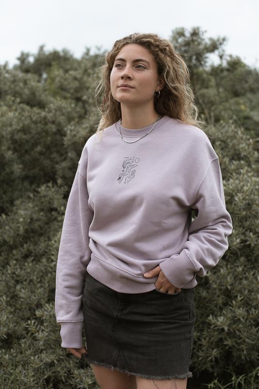 Woman Posing In Grass Of Green Field With Lilac Petal Crewneck