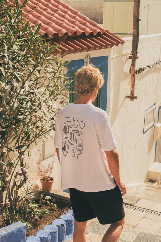 Man Walking Away In Small Streets Of Gran Canaria Wearing Inmind X Hands Collab