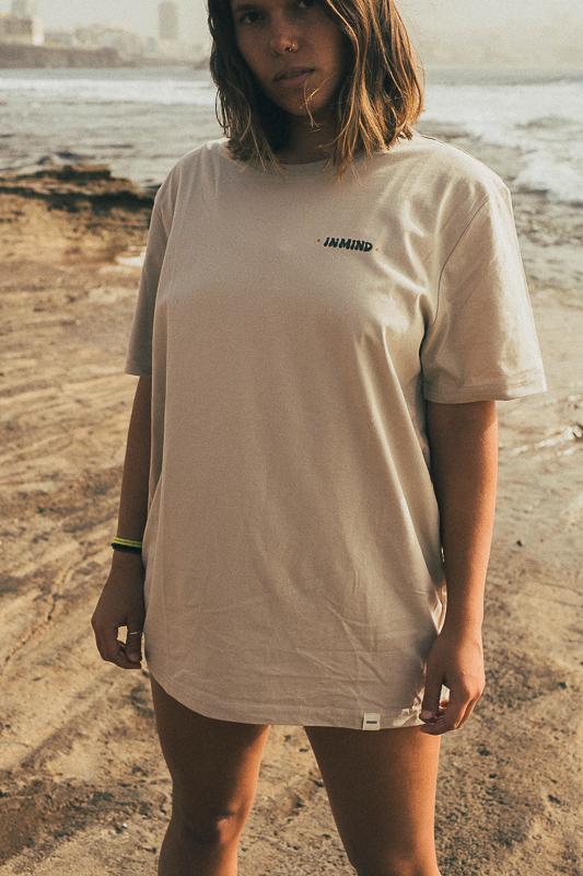 Woman On The Beach With Volcanoes T-Shirt In Desert Dust Collab With Inmind X Handsforfeet